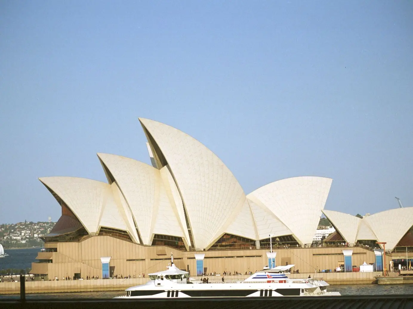 Sydney Opera House on the harbour under a clear sky