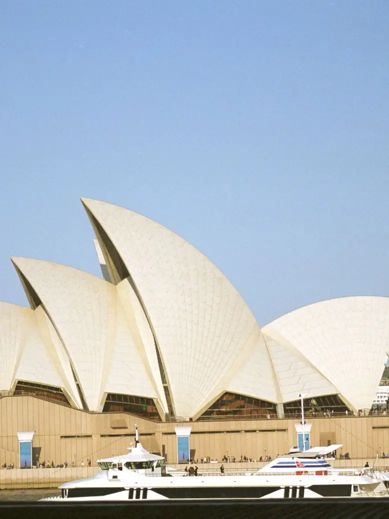 Sydney Opera House on the harbour under a clear sky