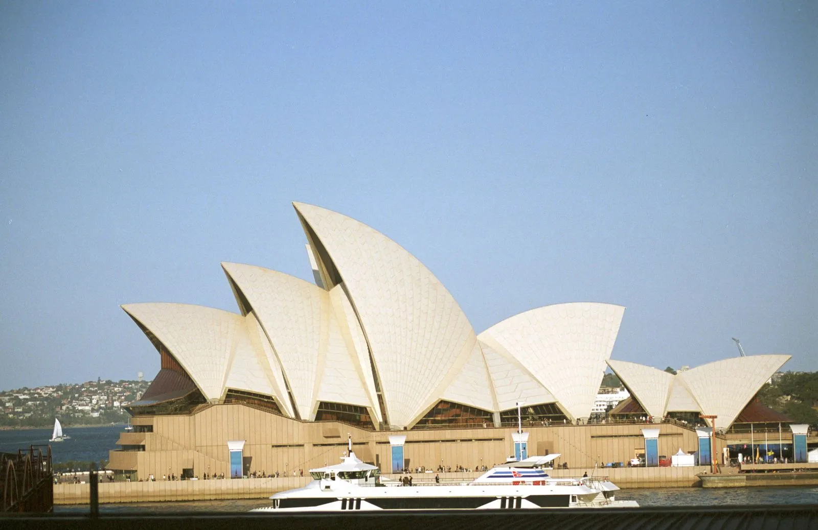 Sydney Opera House on the harbour under a clear sky