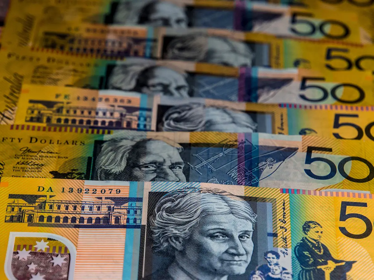Australian fifty-dollar notes laid out in a row