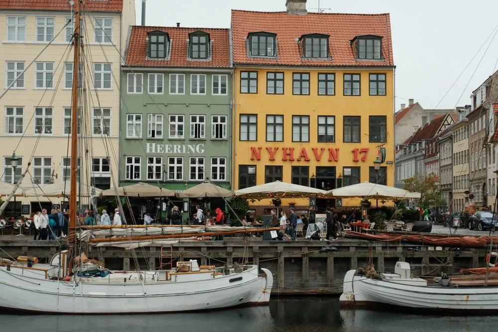 Colourful houses and boats along Nyhavn canal in Copenhagen