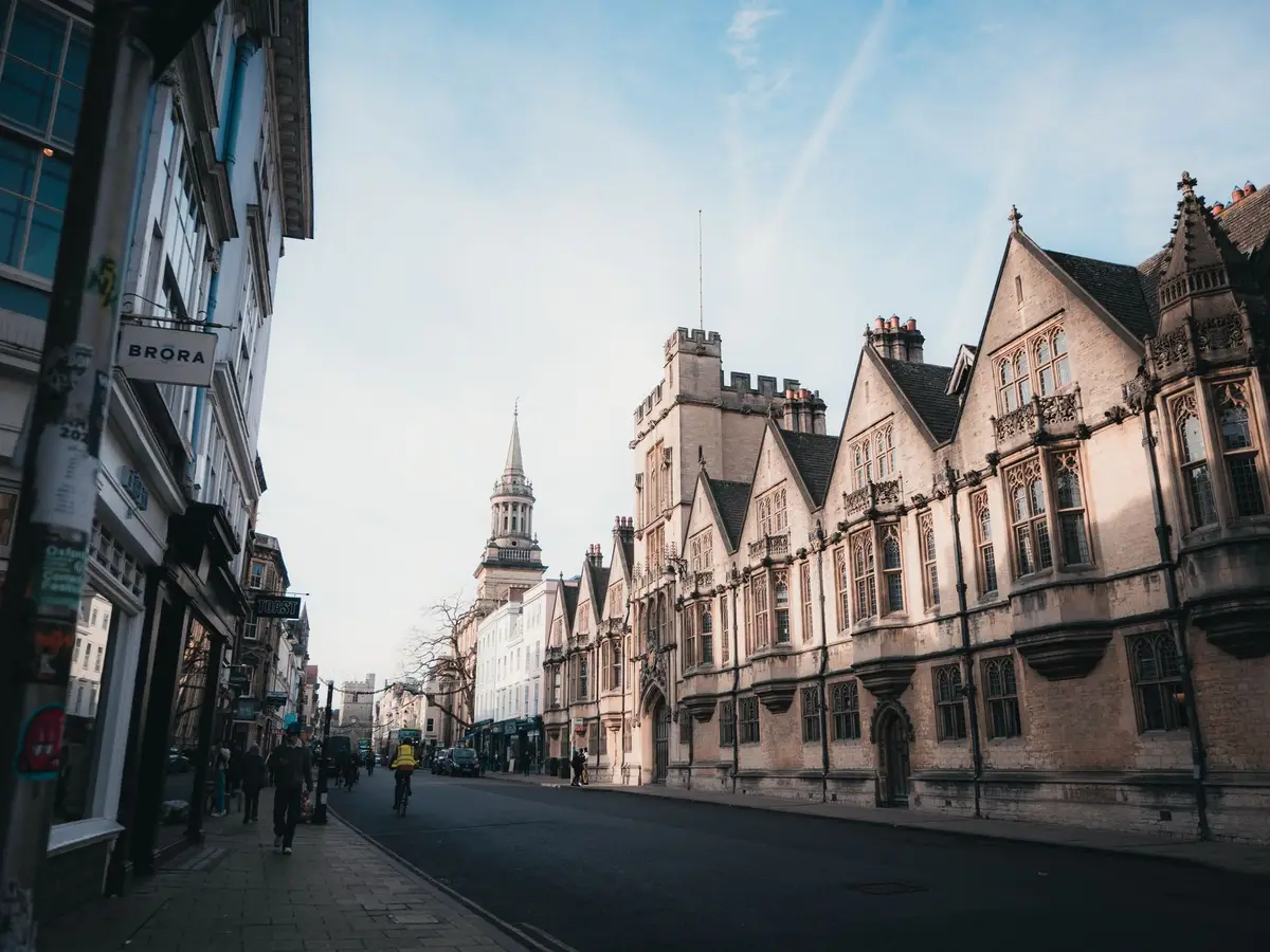 A street of historic college buildings in Oxford at sunrise
