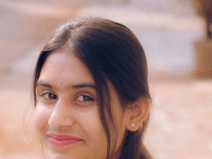 Srijana smiling, in a close-up portrait