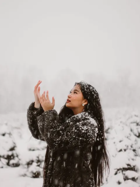 A student enjoying the snowfall in Norway