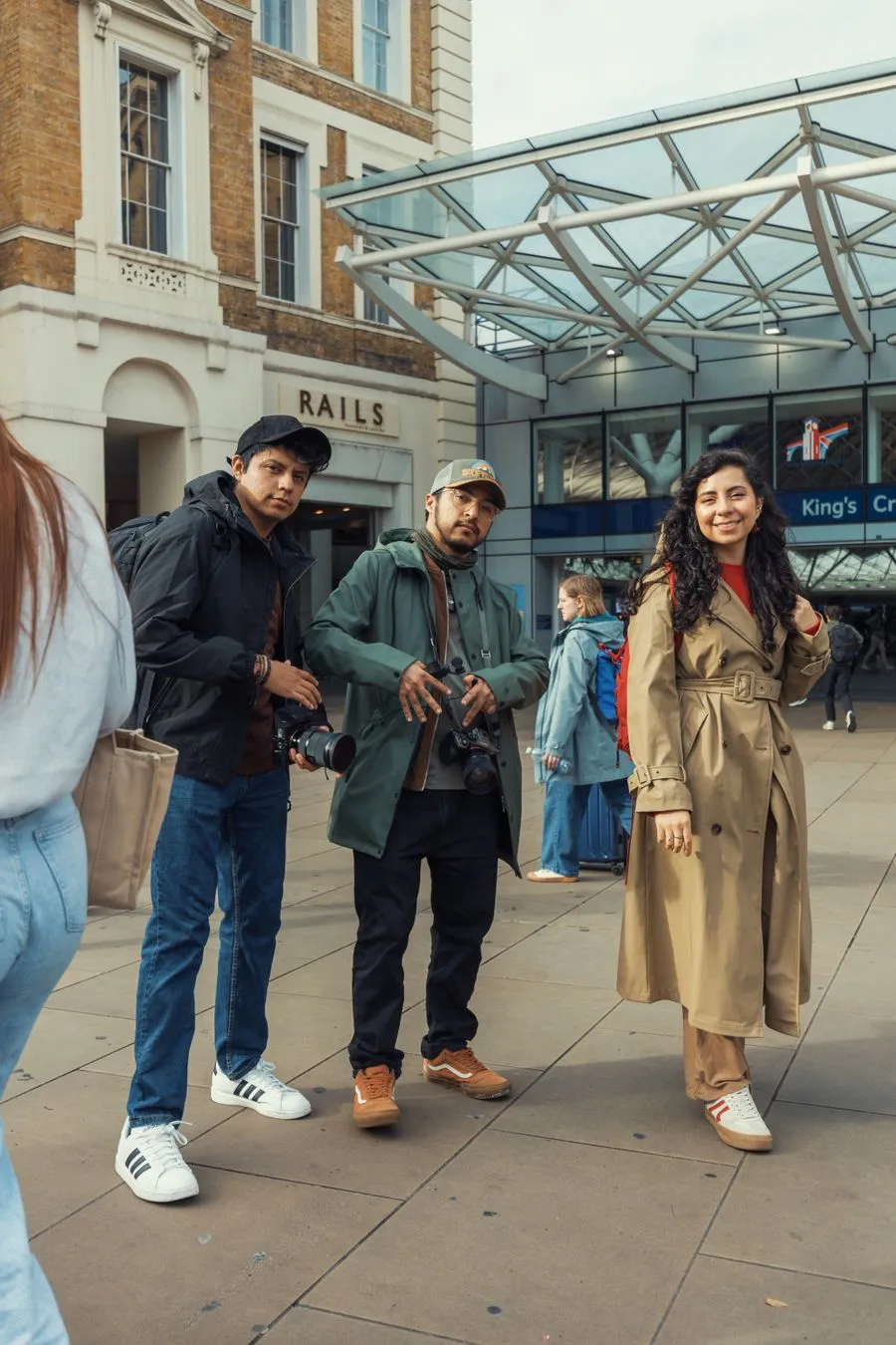 Anushka with two friends outside King's Cross station in London