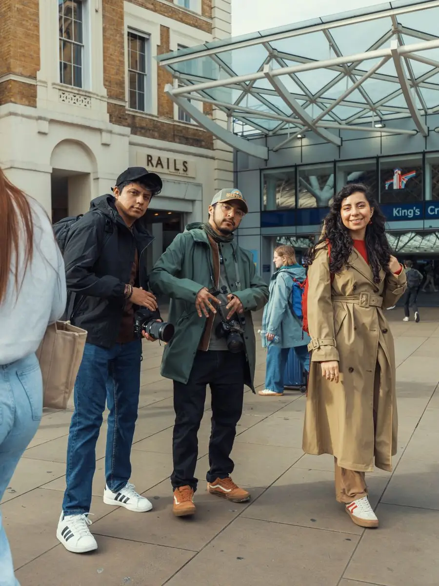 Anushka with two friends outside King's Cross station in London